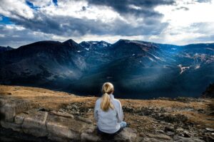 Woman sat reflecting on her experiences as an ADHD woman